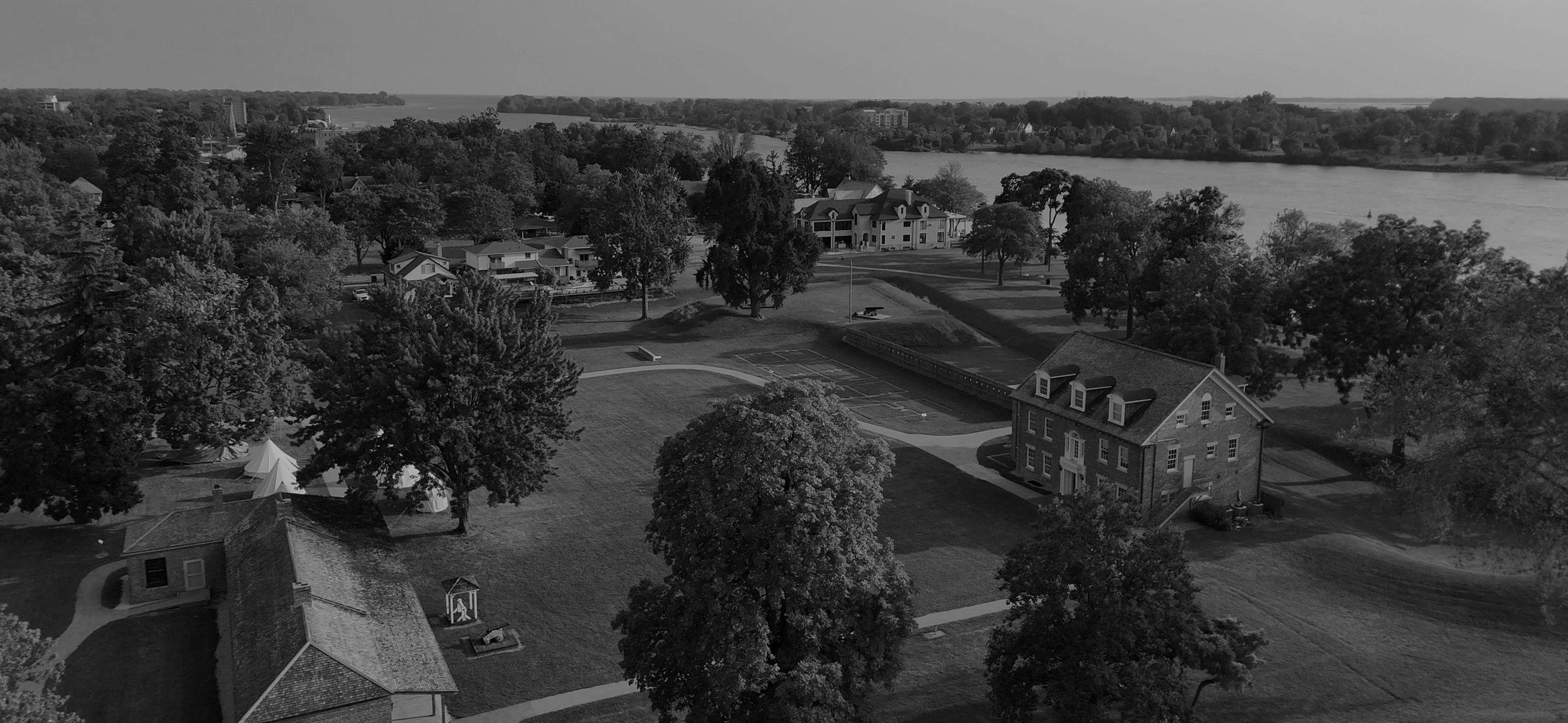 Aerial view of Fort Malden's historic buildings and grounds along the Detroit River in Amherstburg, Ontario.